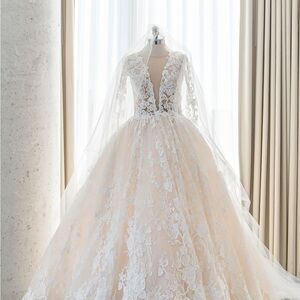 Elegant Lace Wedding Dress featured in Wedluxe